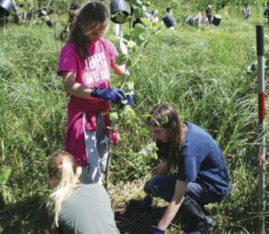 Ridge and Valley Students volunteers planting trees along the Paulins Kill